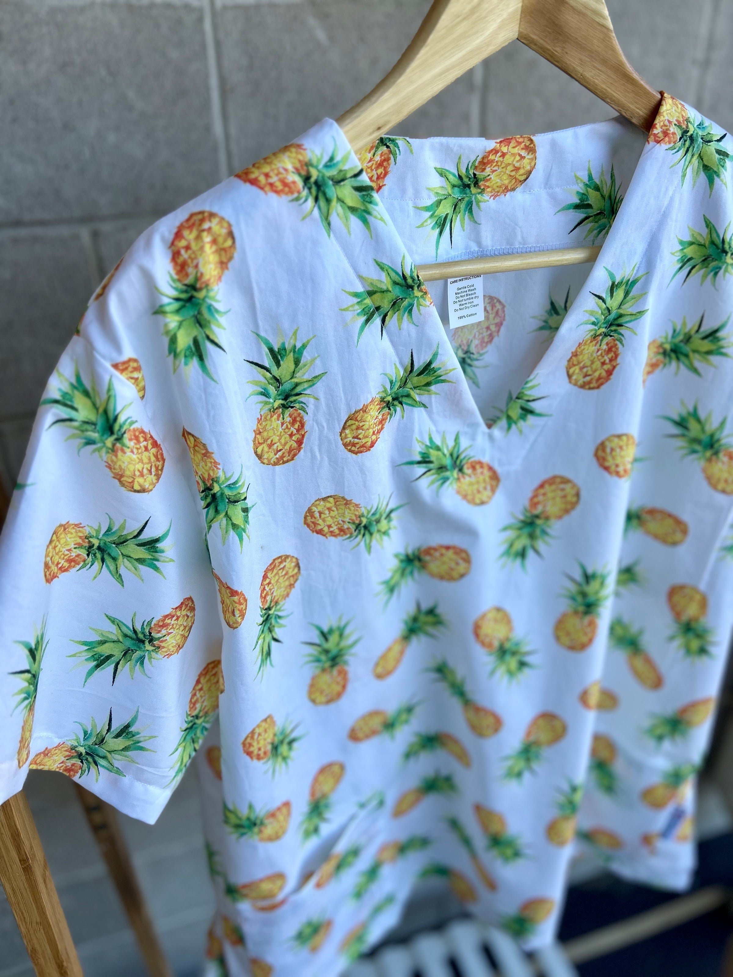 Pineapples scrub top