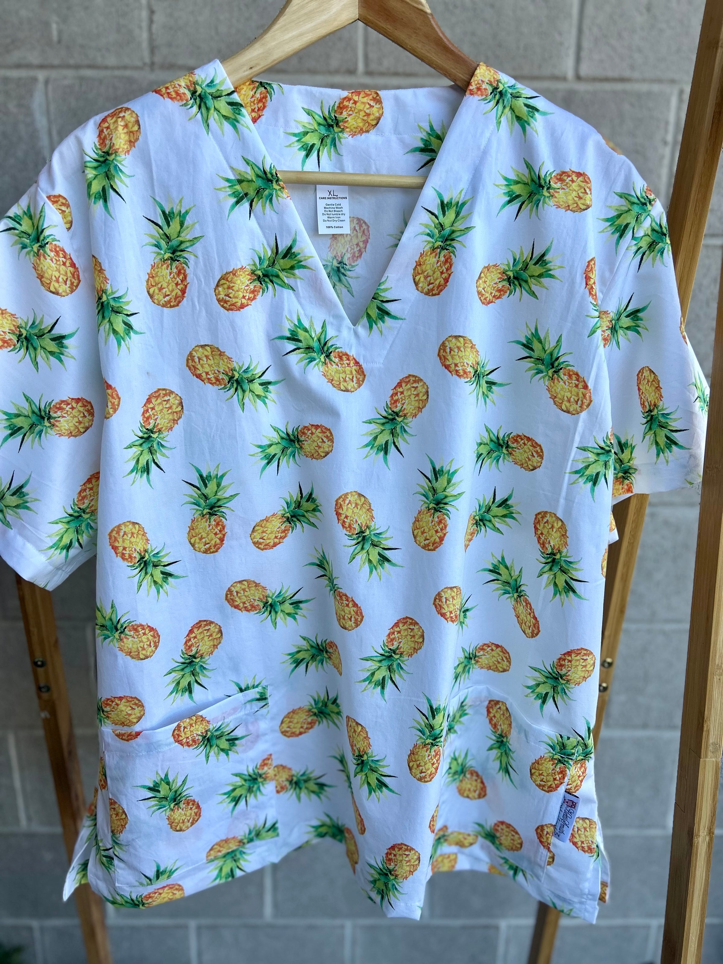 Pineapples scrub top