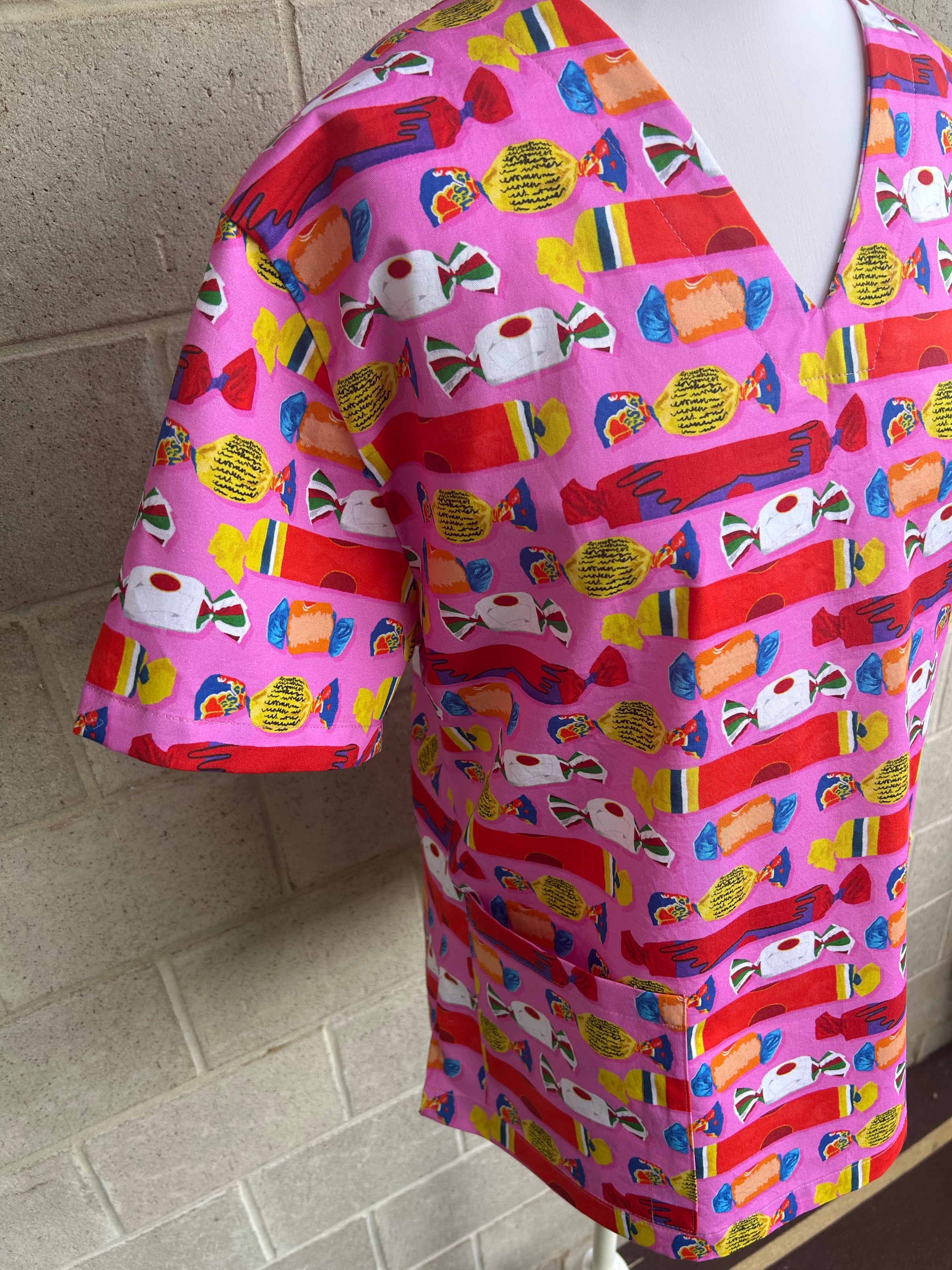 Wrapped lollies pink scrub top (size XS-M only)
