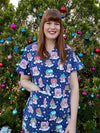 Gingerbread village scrub top