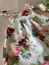 Cream floral pinafore.